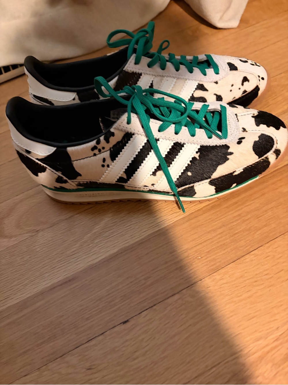 adidas Women’s Black & White Cow Print Sneakers with Green Laces